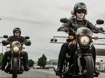 Man and Woman Riding Their Motorcycle