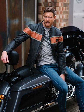 man in a leather jacket sitting on a motorcycle