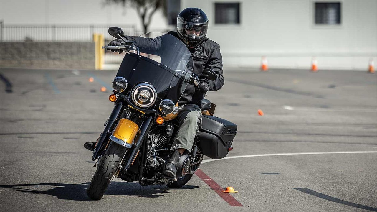 Person on motorcycle practicing skills on a training range