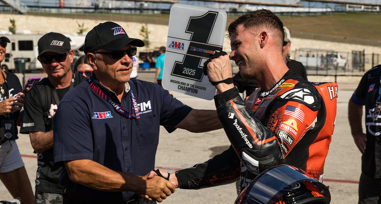 Kyle Wyman shaking hands