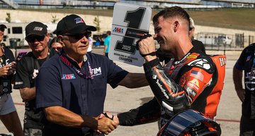 Kyle Wyman shaking hands