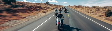 group of riders on road