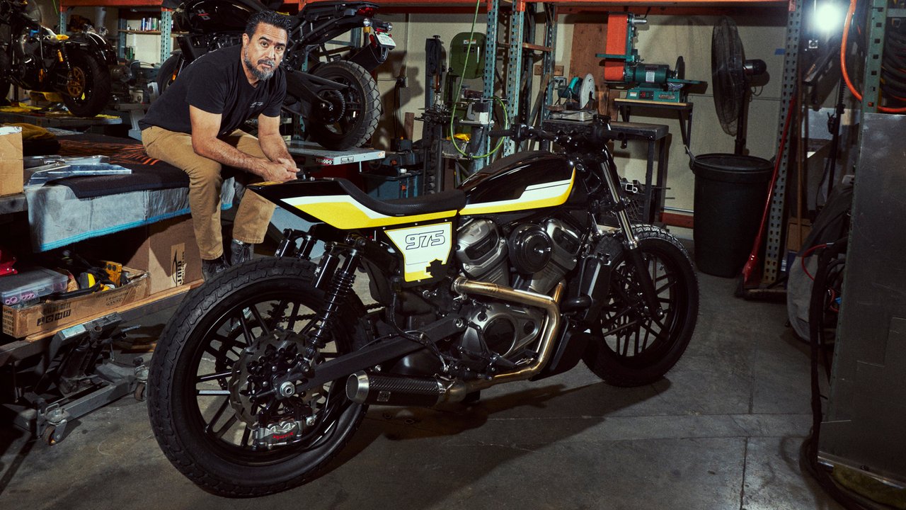 Brandon Holstein with their customized motorcycle