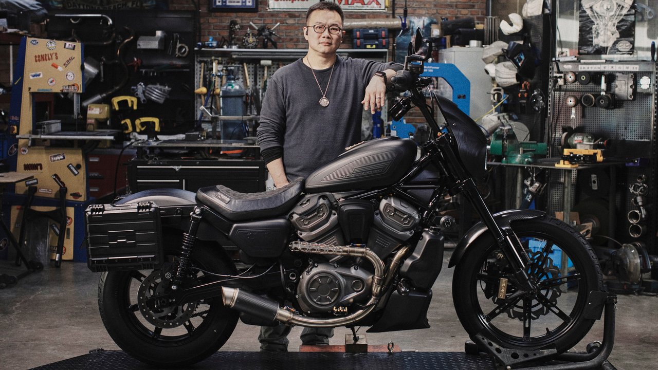 Wang Qiuming with their customized motorcycle
