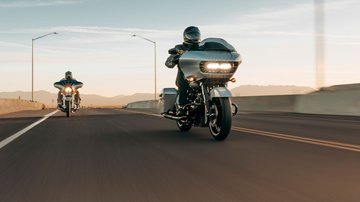Two riders on Road Glide Special going down the road