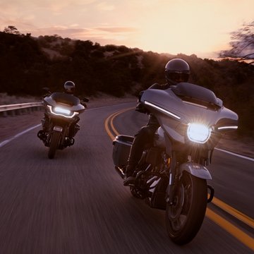 cvo motorcycles going around a curve