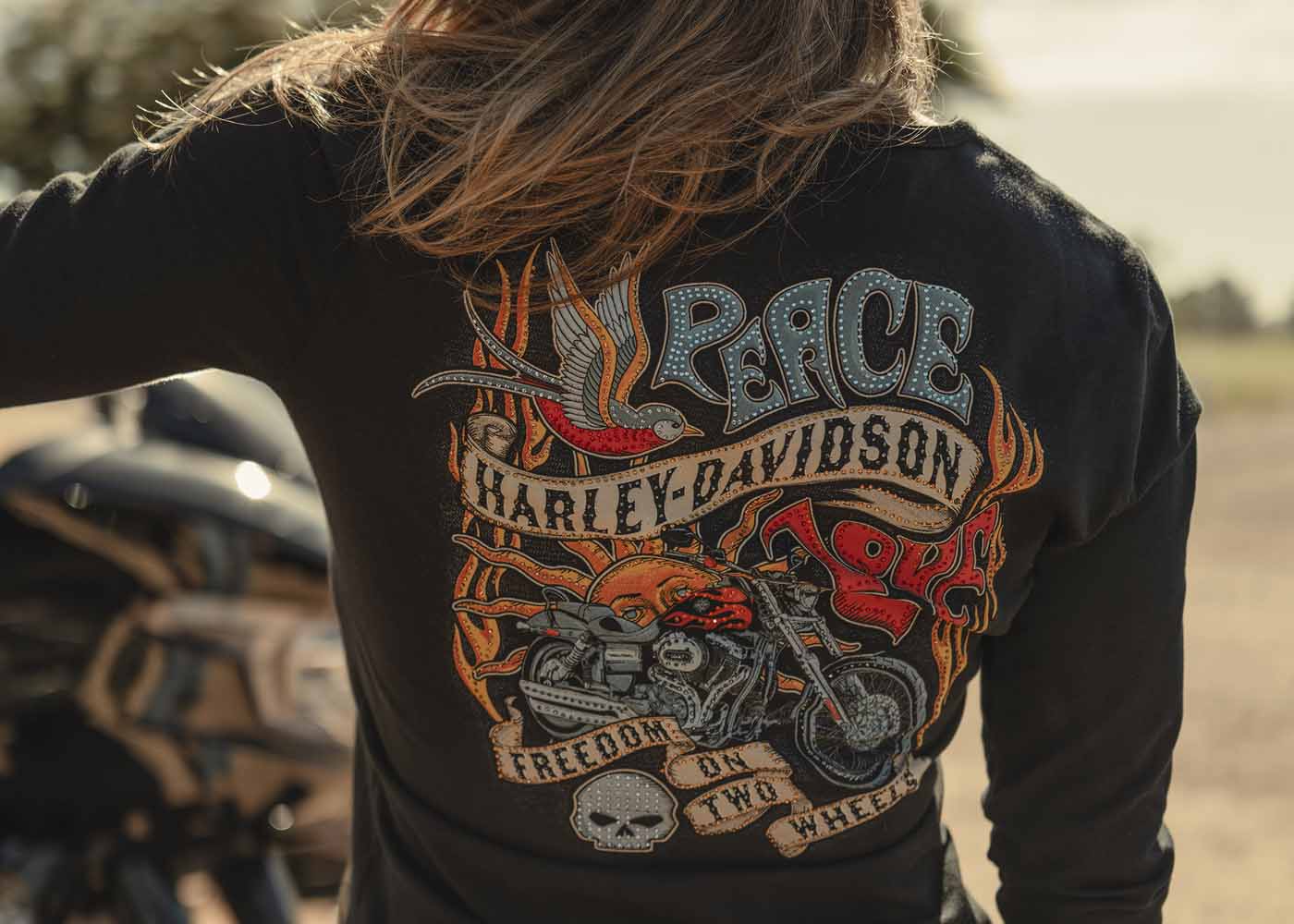 woman wearing a shirt next to a bike