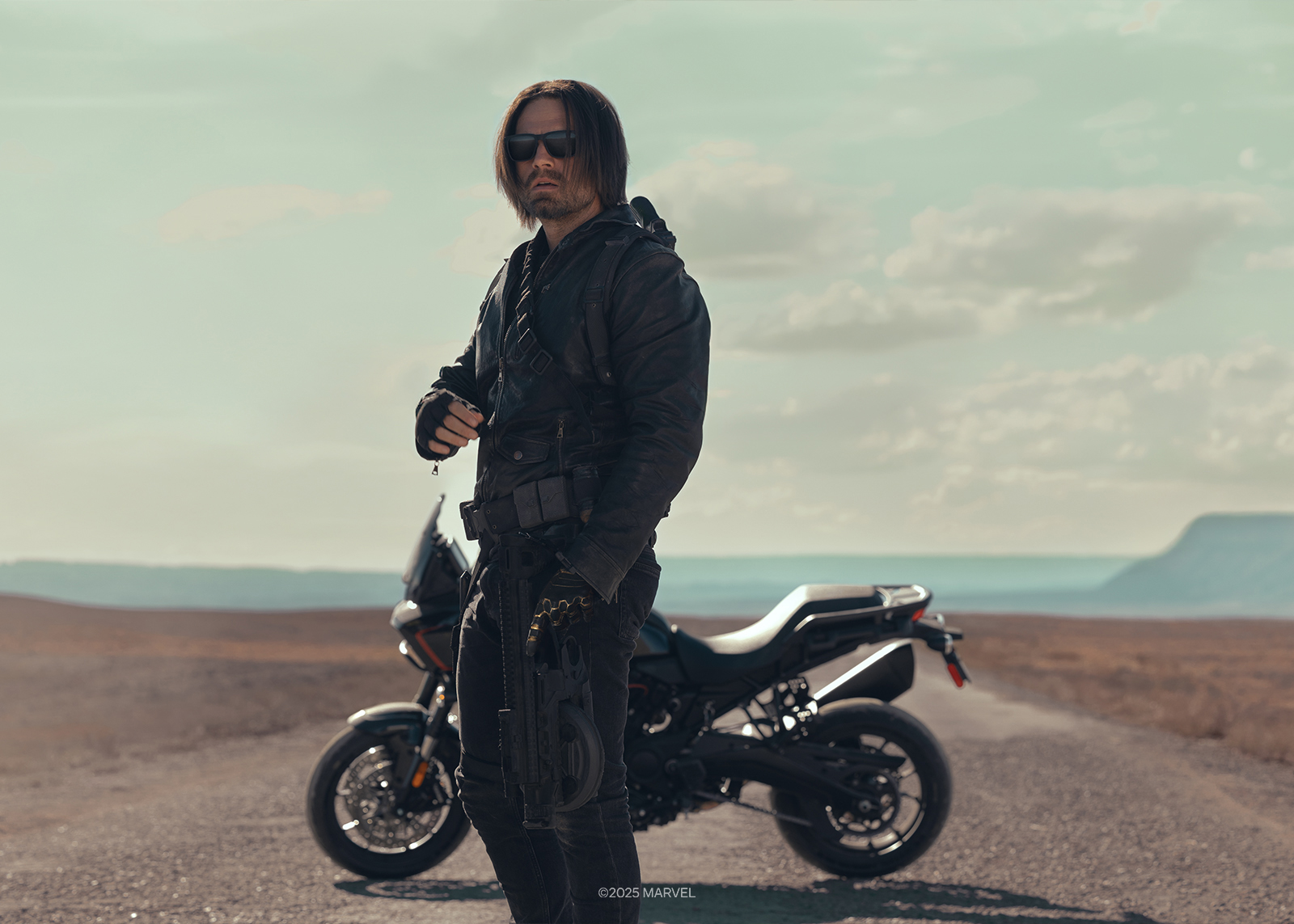 A man standing in front of a motorcycle