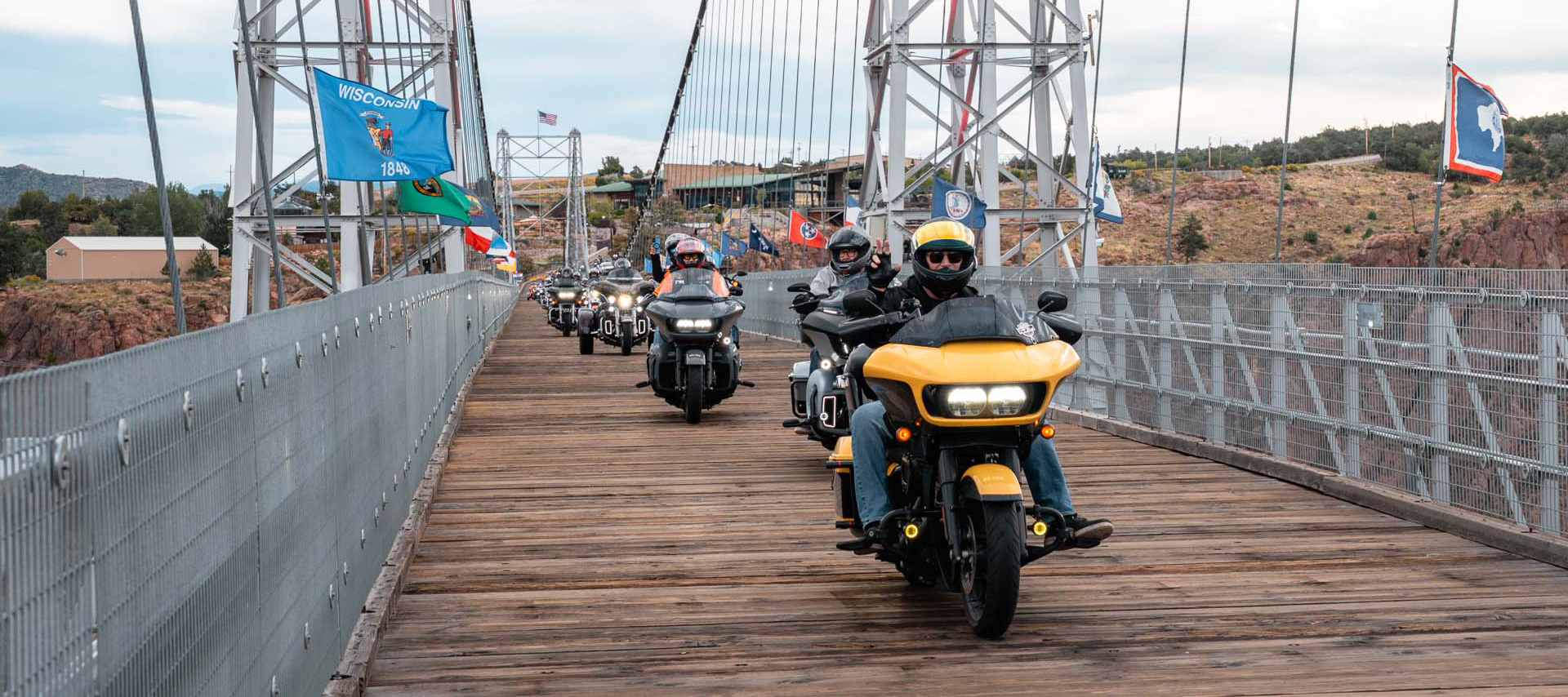  A group of motorcycles ride over the wooden planked Royal Gorge suspension bridge near Cañon City, CO