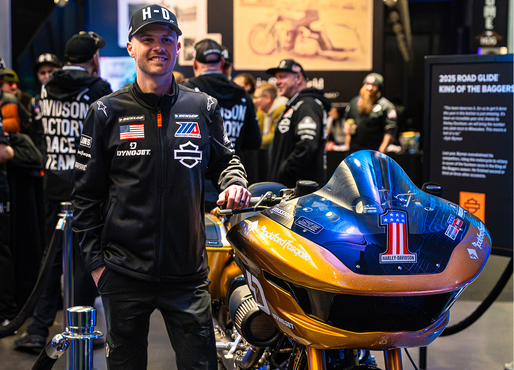 Harley-Davidson champion Kyle Wyman poses next to his gold number 1 King of the Baggers racing motorcycle