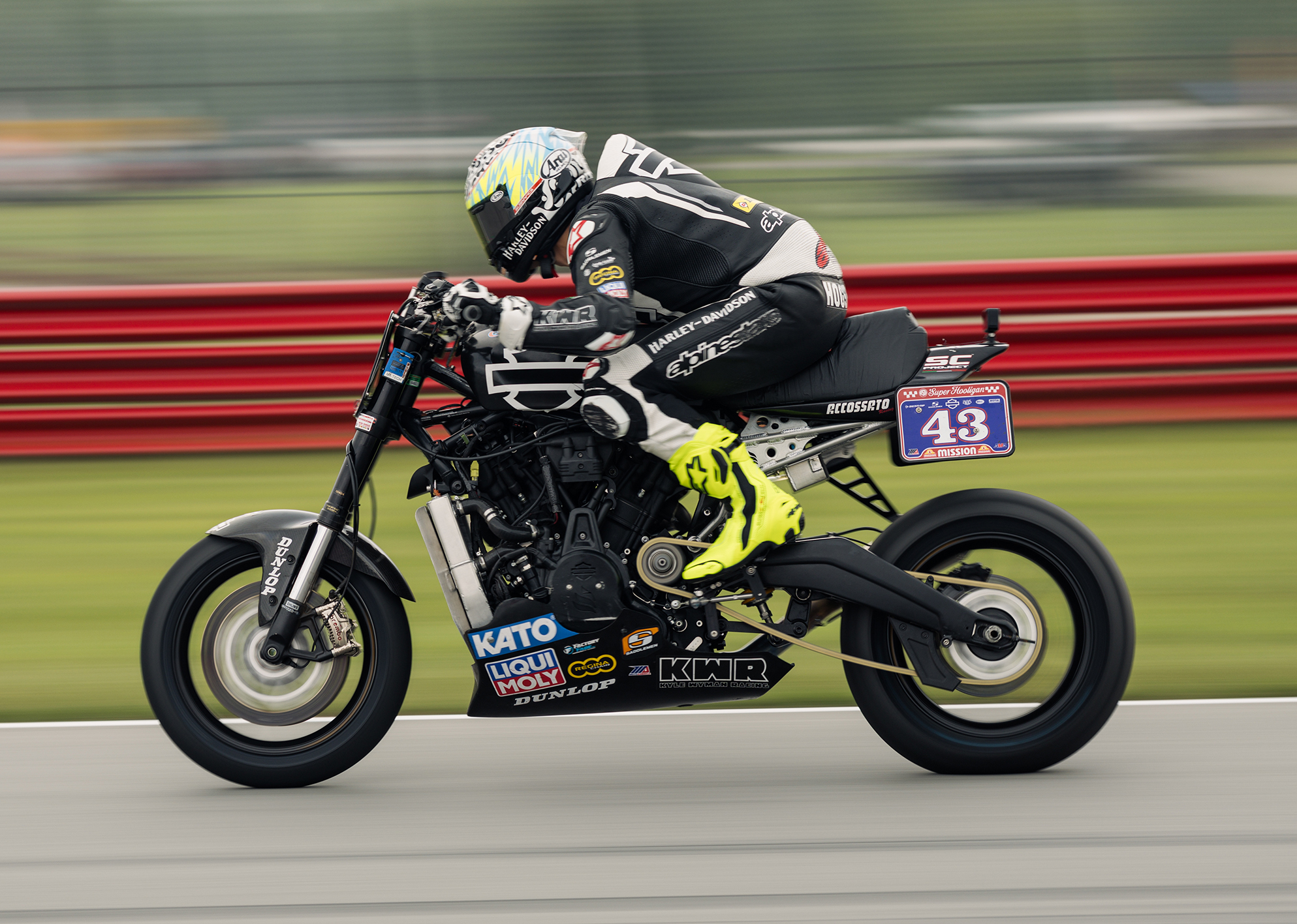 James Rispoli tucks low on his #43 Harley-Davidson during a high-speed section of the racetrack.