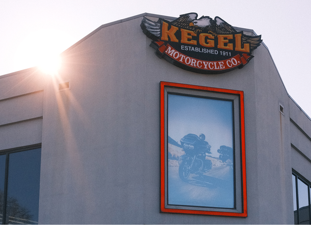 Exterior of Kegel Harley-Davidson with a Kegel Motorcycle Co. sign and a framed image of a motorcycle