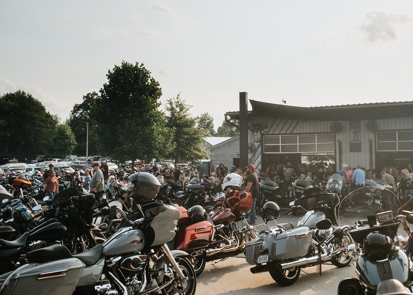A parking lot full of bikes outside the Smokey Mountain Harley-Davidson dealership.