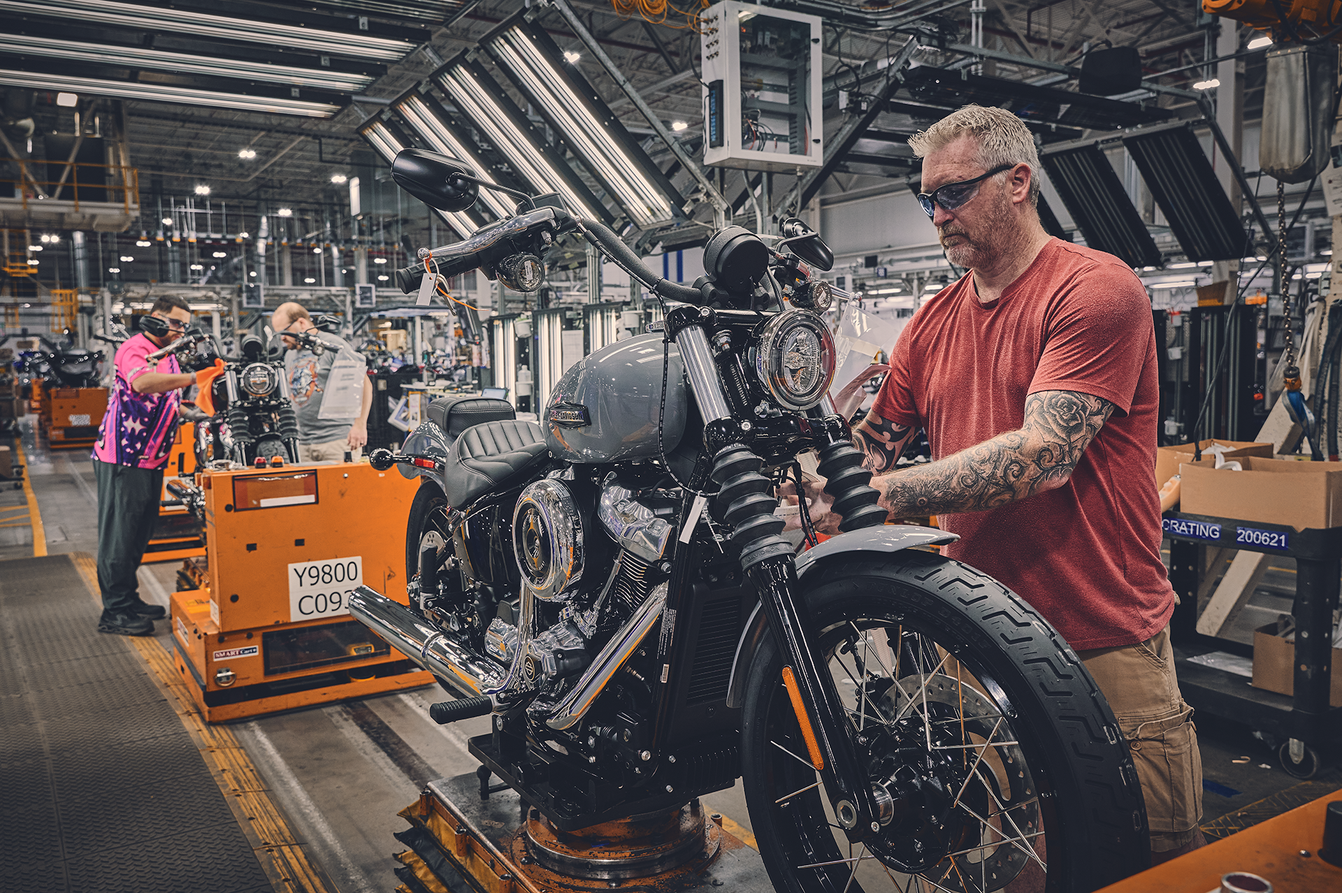 A worker builds a motorcycle on assembly line at the York plant