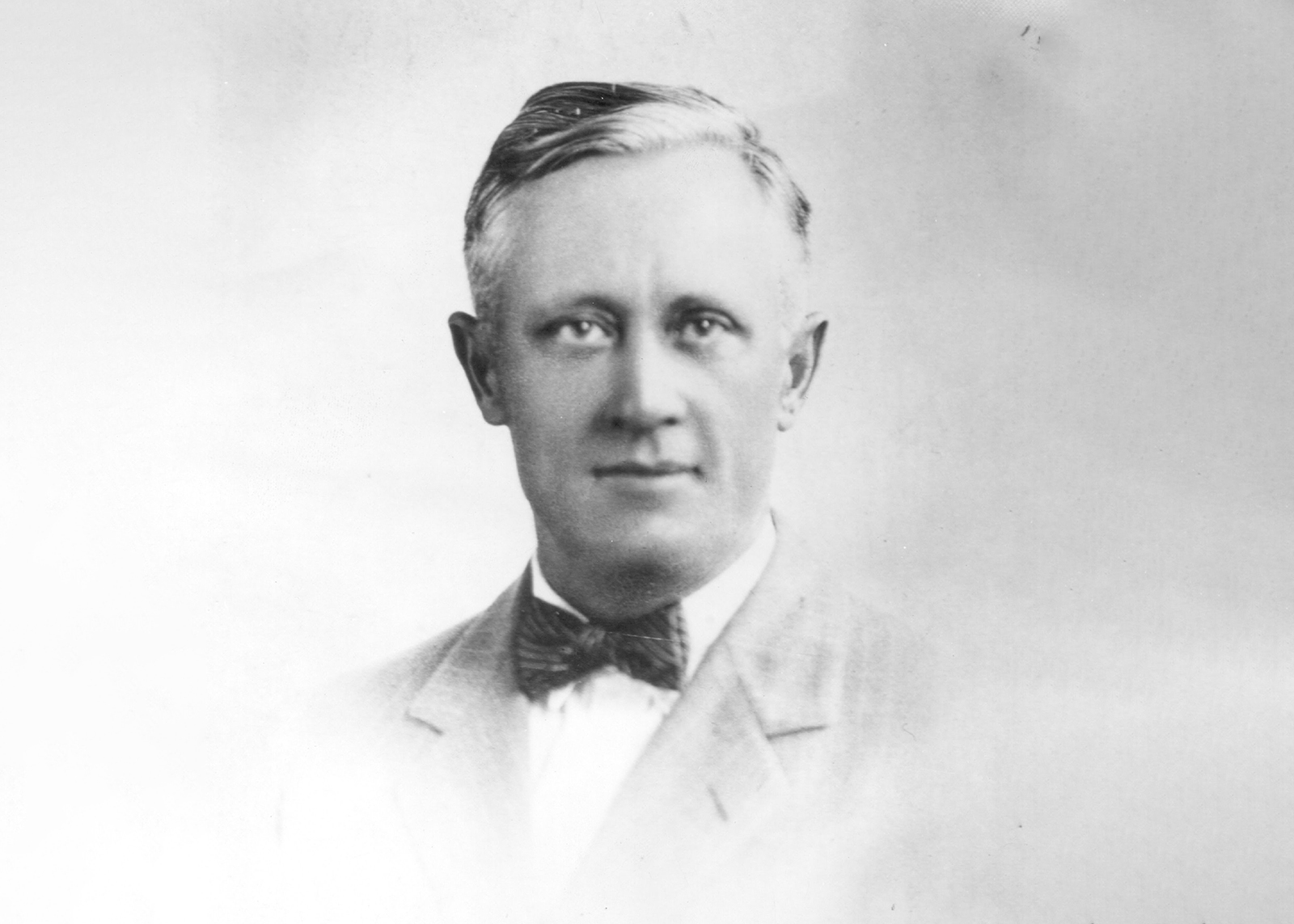 vintage black and white portrait of a man in a suit 