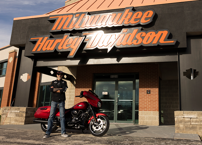 Diamond Tier winner Justin Patterson stands next to his new 2025 Street Glide in front of Milwaukee Harley-Davidson