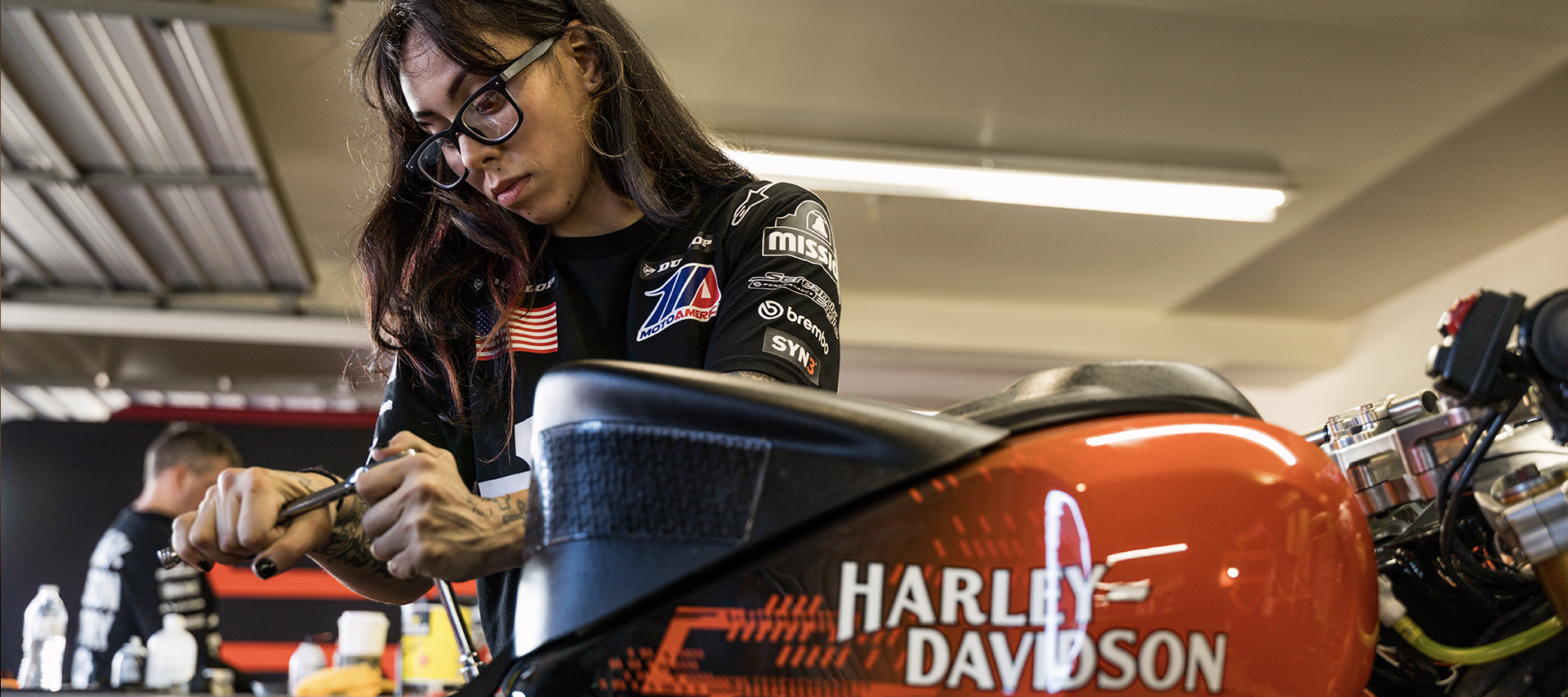 Harley-Davidson Factory Racing Secondary Mechanic Alexcis Shultz works on a race bike in the HDFR garage.