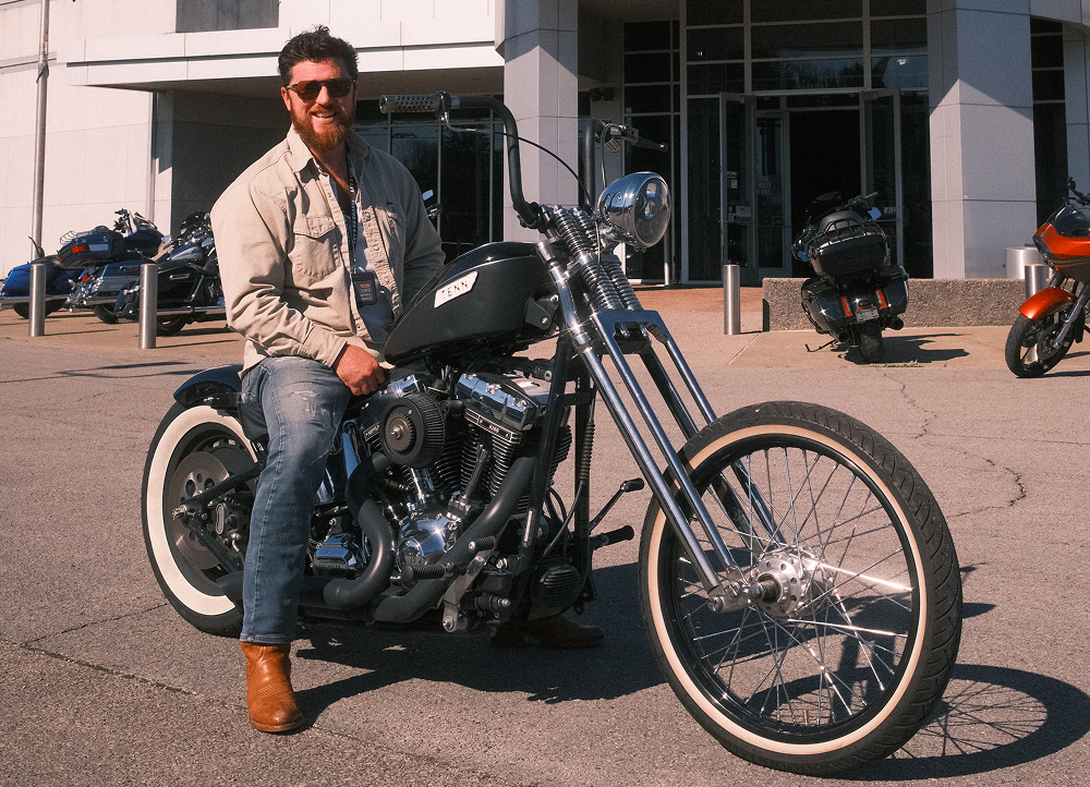 Bumpus Harley-Davidson General Manager Ryan Tapley seated on his custom Harley-Davidson motorcycle