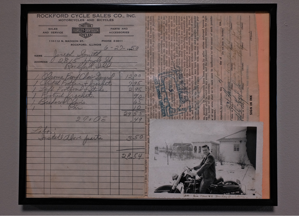A framed vintage receipt dated 6-27-1950 with a photo of a customer on a 1949 model Harley-Davidson