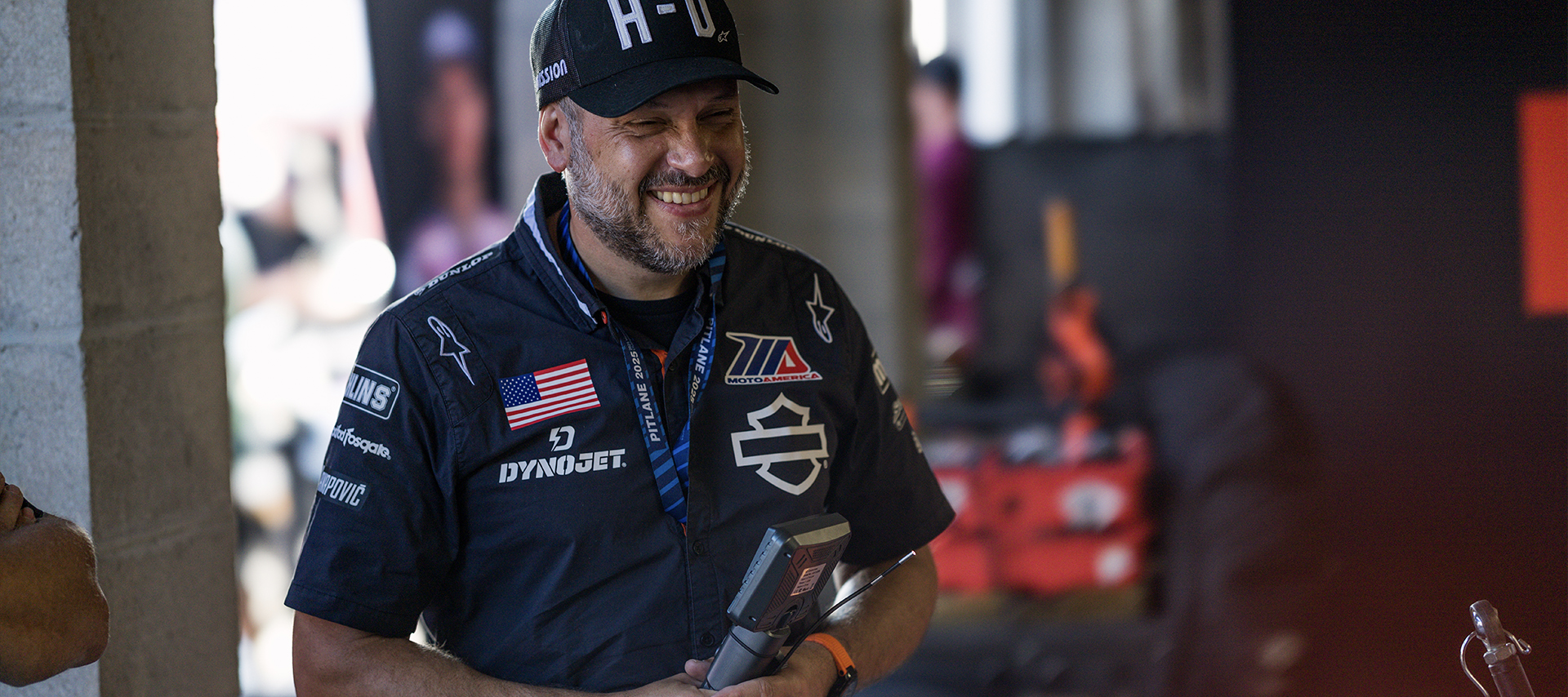 Harley-Davidson Factory Racing Engineering Manager Matthew Meuller laughs while at work in the race garage.