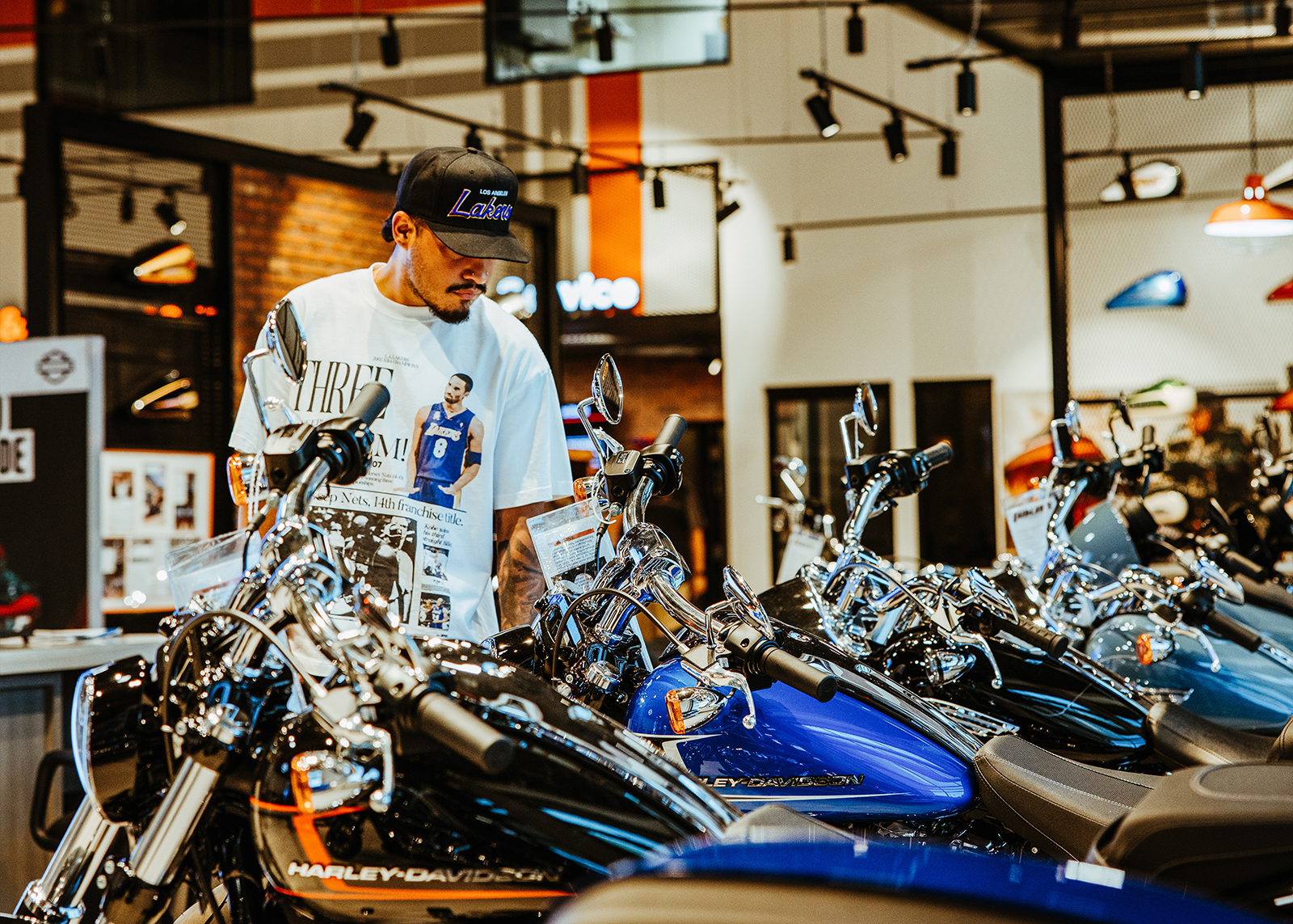 A customer looks at motorcycles on the showroom floor of Laidlaw’s Harley-Davidson.