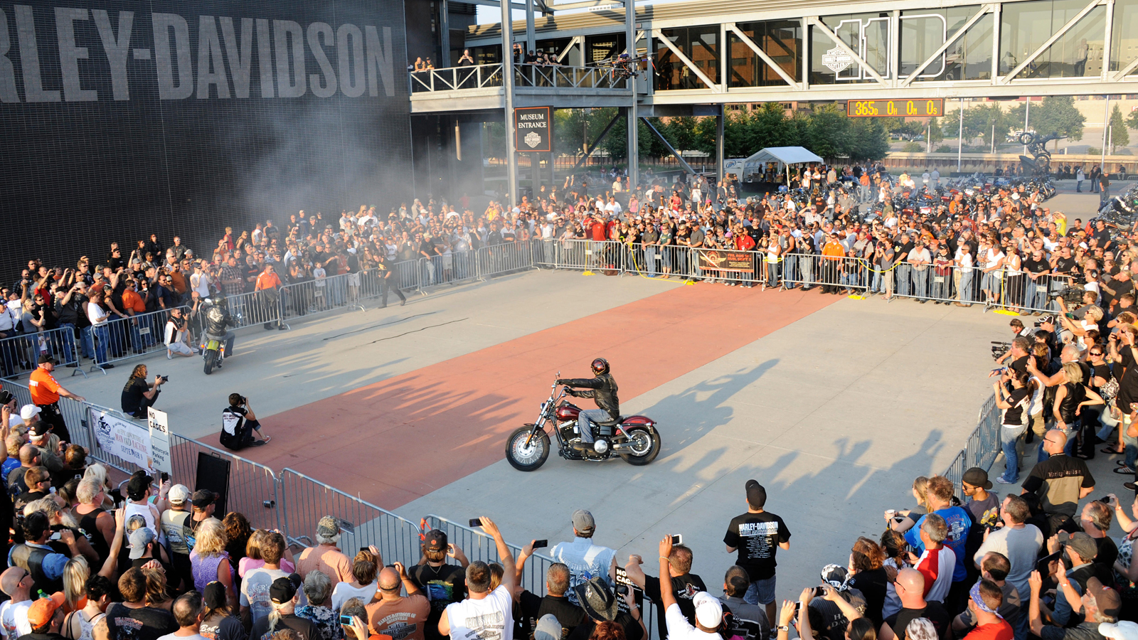 Stunt rider in front of crowd at the H-D Museum