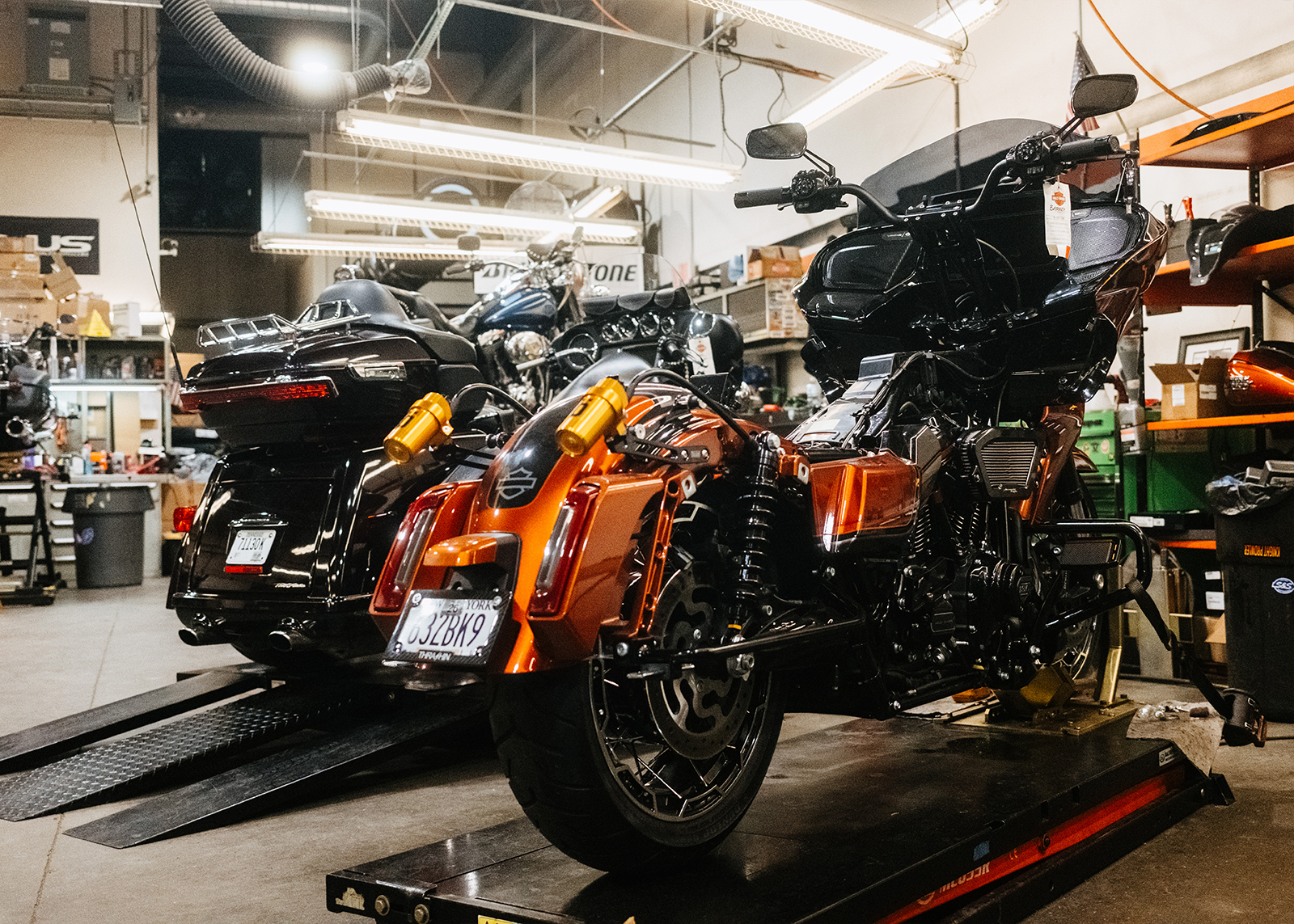 Two performance motorcycles in the Moonshine HD service department.