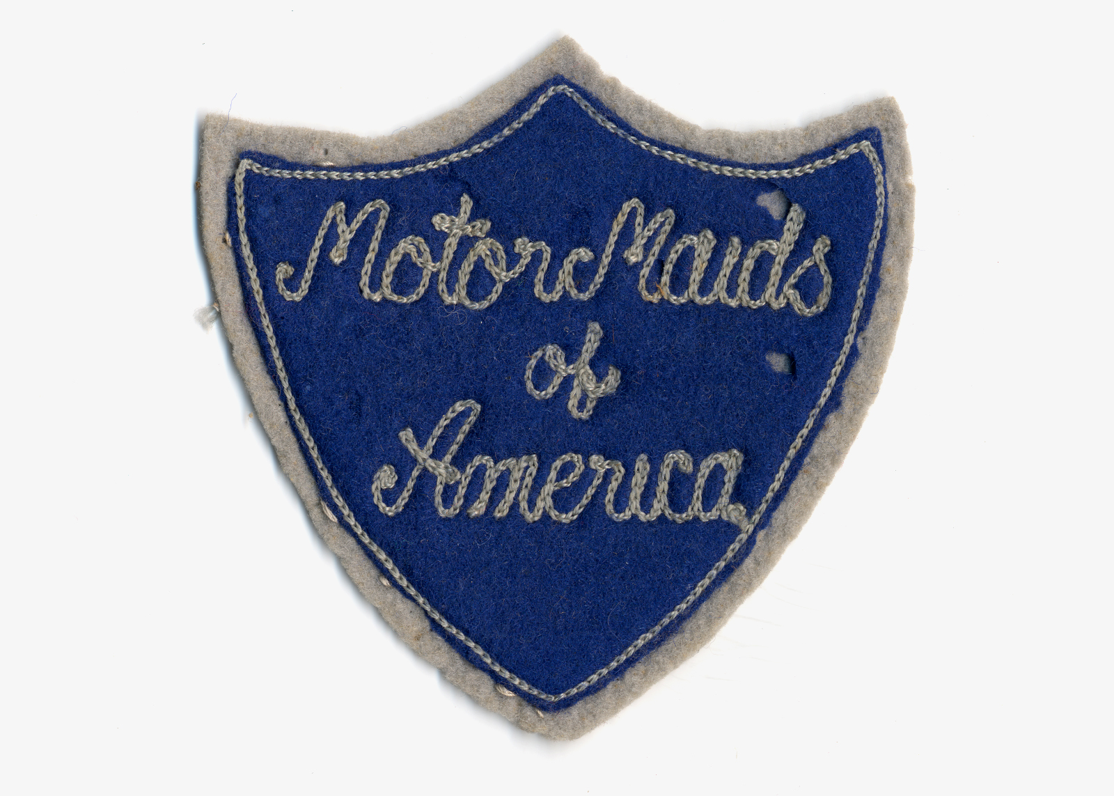 Vintage blue and gray embroidered shield patch reading “Motor Maids of America” in script lettering.
