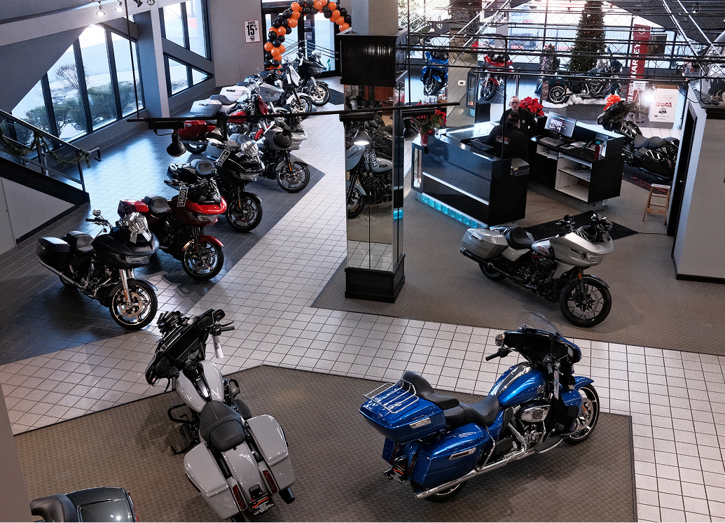 Looking down at the showroom of Kegel Harley-Davidson with parked motorcycles and a tiled walkway