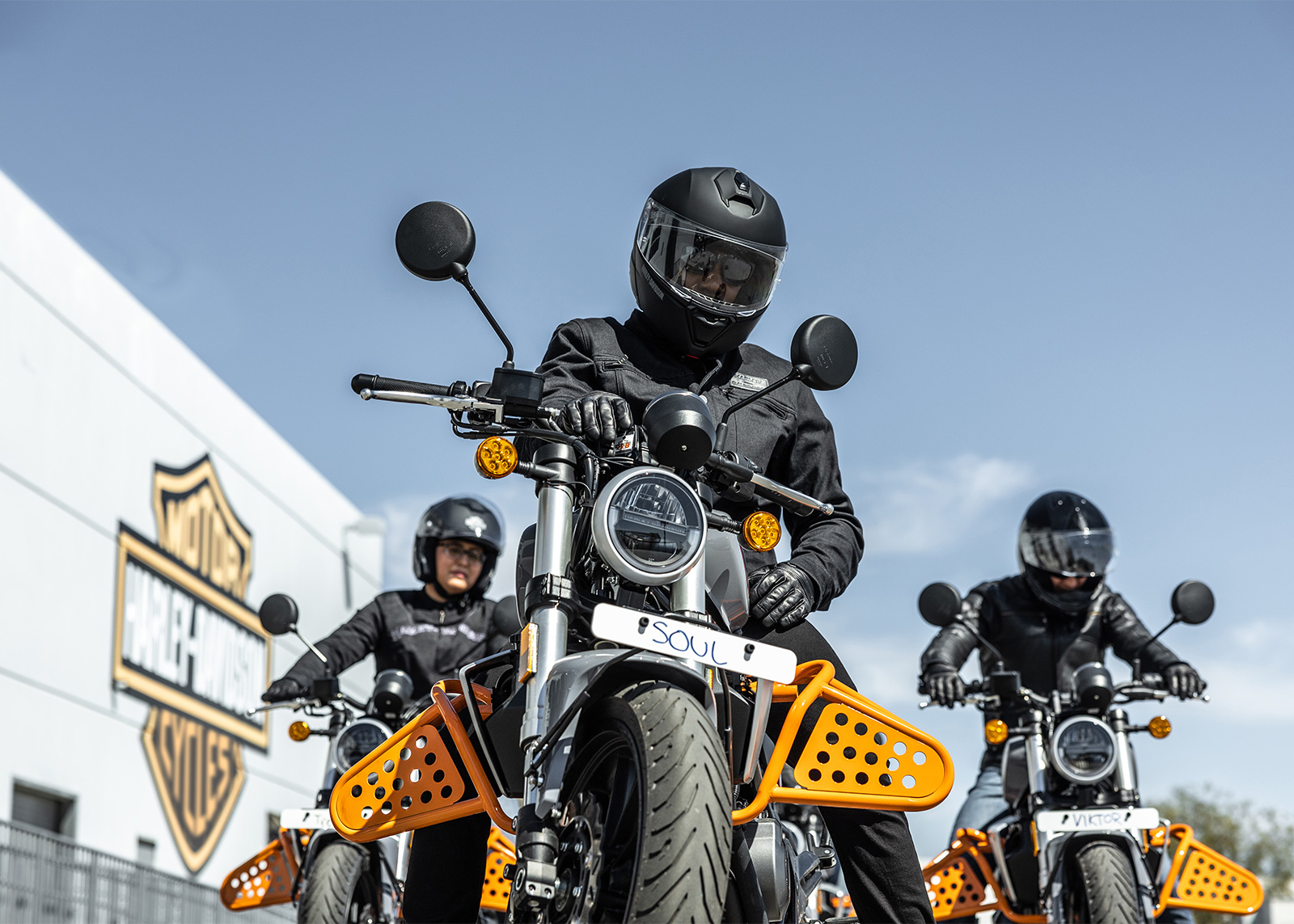 Group of 3 Riding Academy riders training on practice course