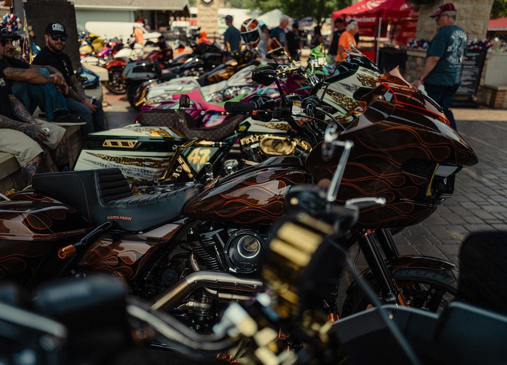 Custom Harley-Davidson motorcycles line Rally Point during the V-Twin Visionary Performance Show in Sturgis