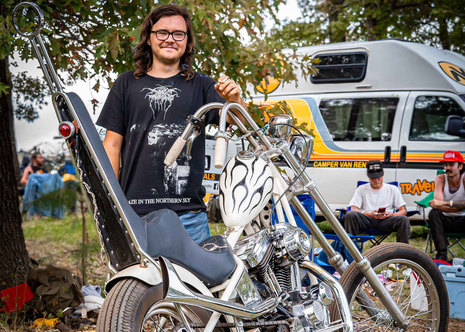 A man poses with a white chopper