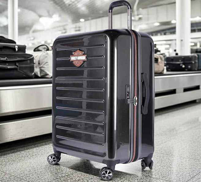 Black roller suitcase with Bar & Shield logo