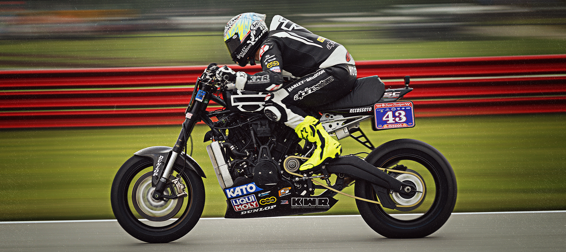James Rispoli in full gear leans forward on bike #43 during a high-speed Super Hooligan race.