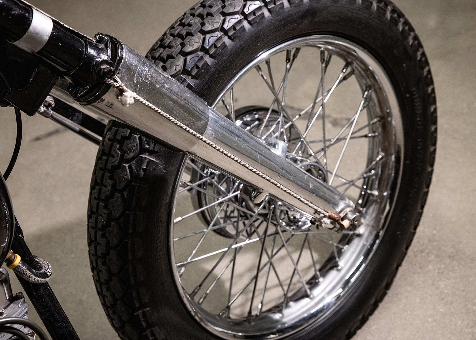 A detail shot of the front forks on Alfonso Sotomayor’s 1957 Harley-Davidson FL modified with rope to help with hard landings.
