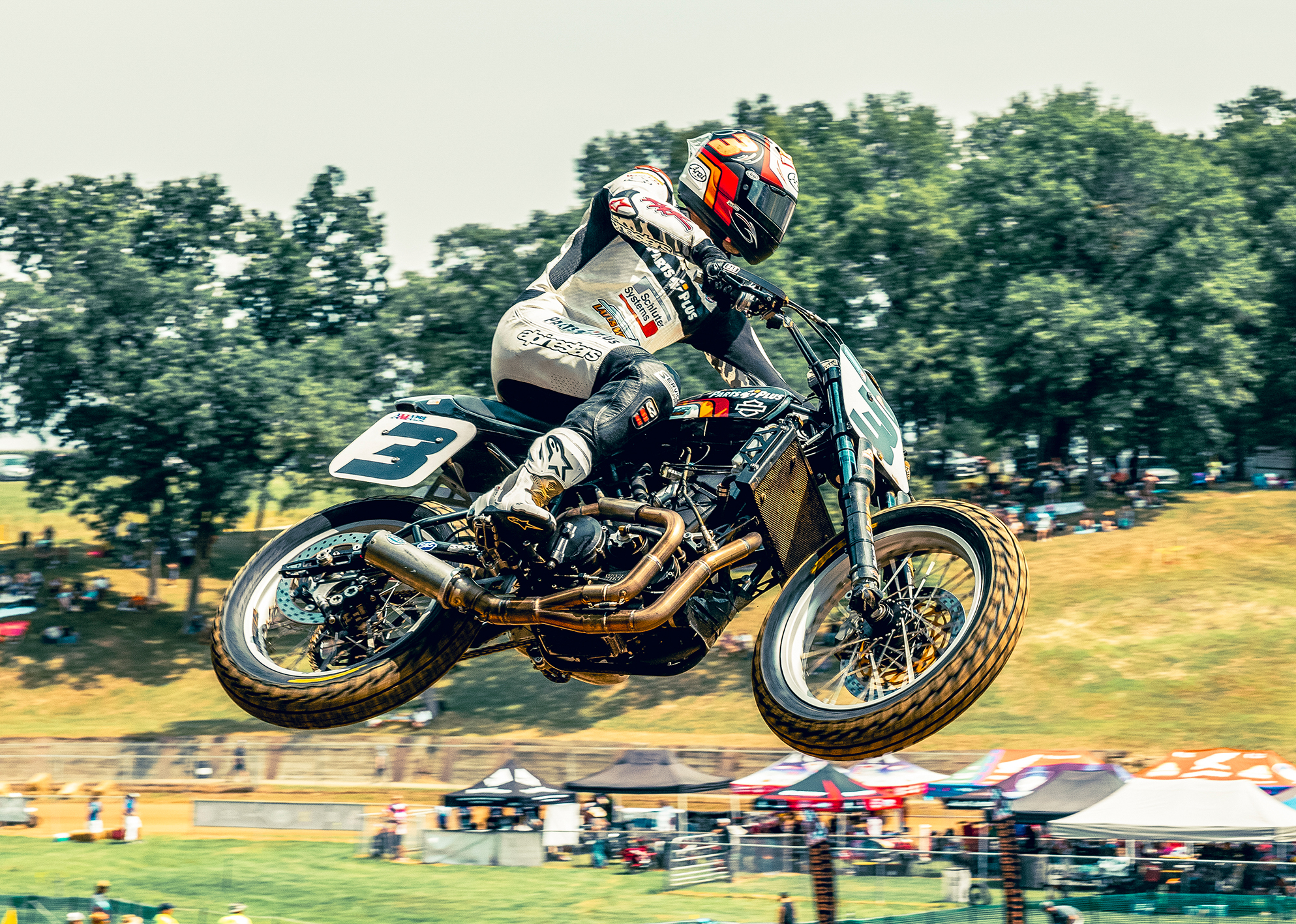 Number 3 Briar Bauman is seen in mid-air going over a jump during a Tourist Trophy race