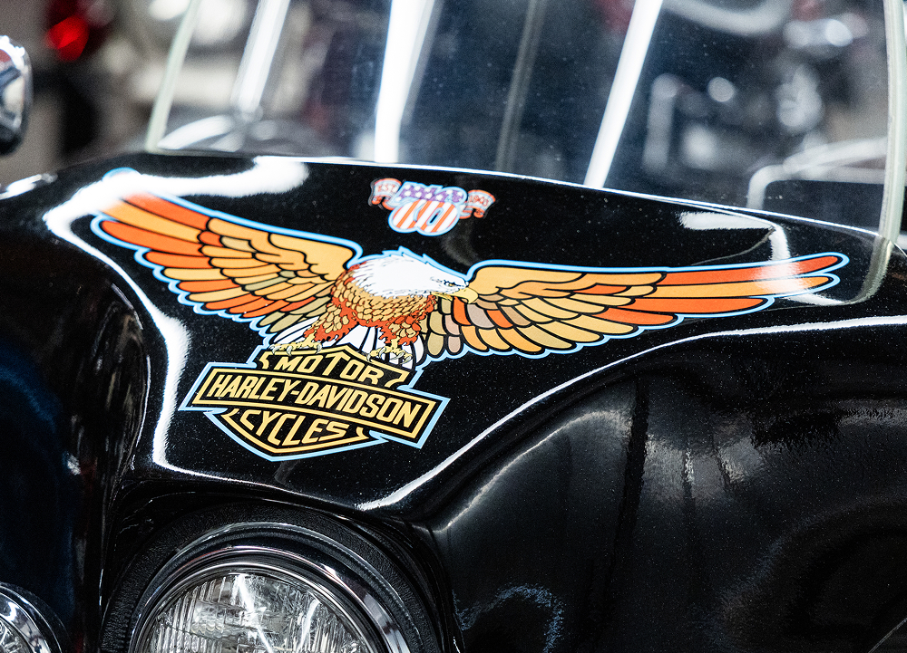 Close-up of a black 1976 Harley-Davidson front fairing featuring the iconic eagle and Bar & Shield graphic