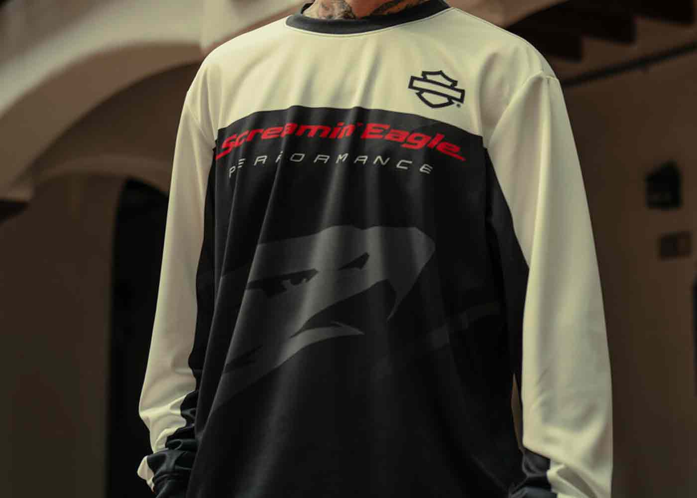 man wearing a black and white long sleeve shirt