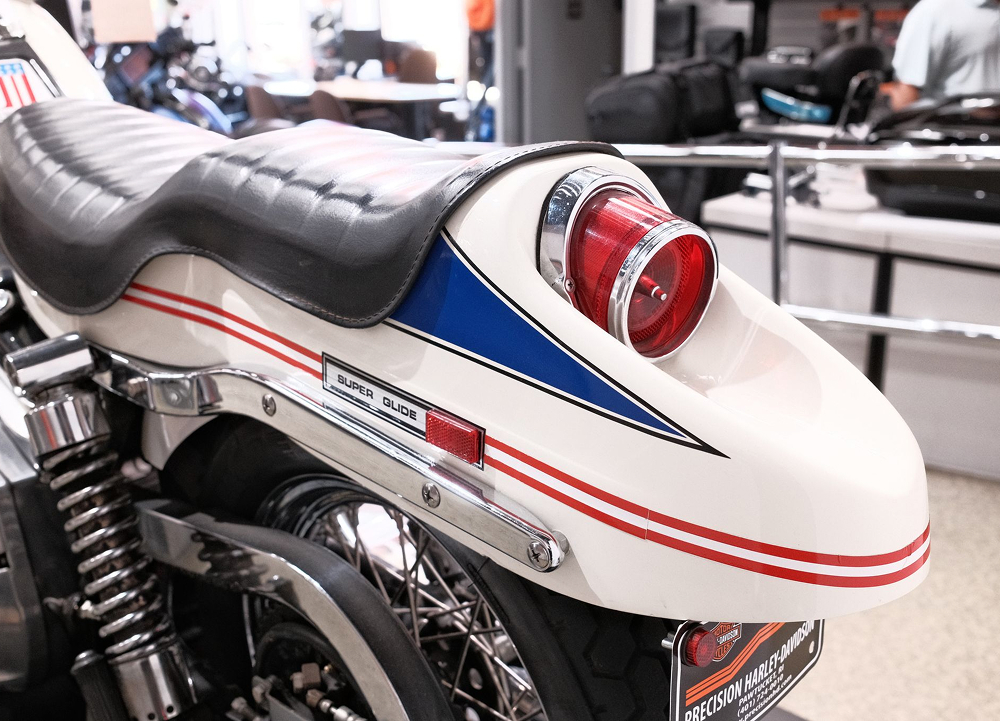 A close up of the distinct boattail rear fender of the 1971 FX Super Glide on display at Precision H-D