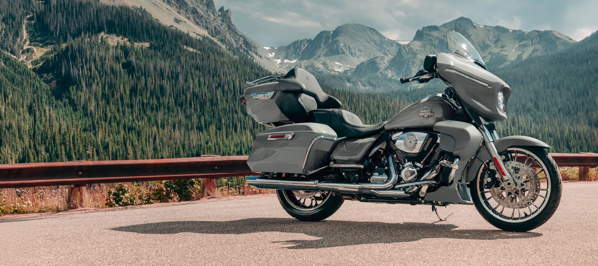 2026 Street Glide motorcycle parked at lookout with mountains and trees in the background
