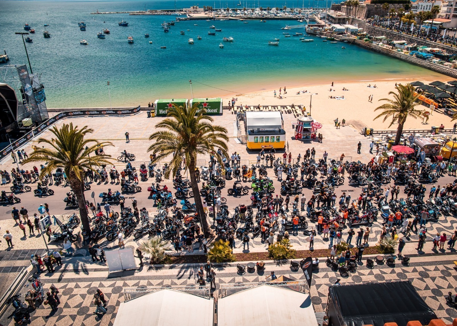 Motorcycle and crowd at a beachside bike rally in Cascais