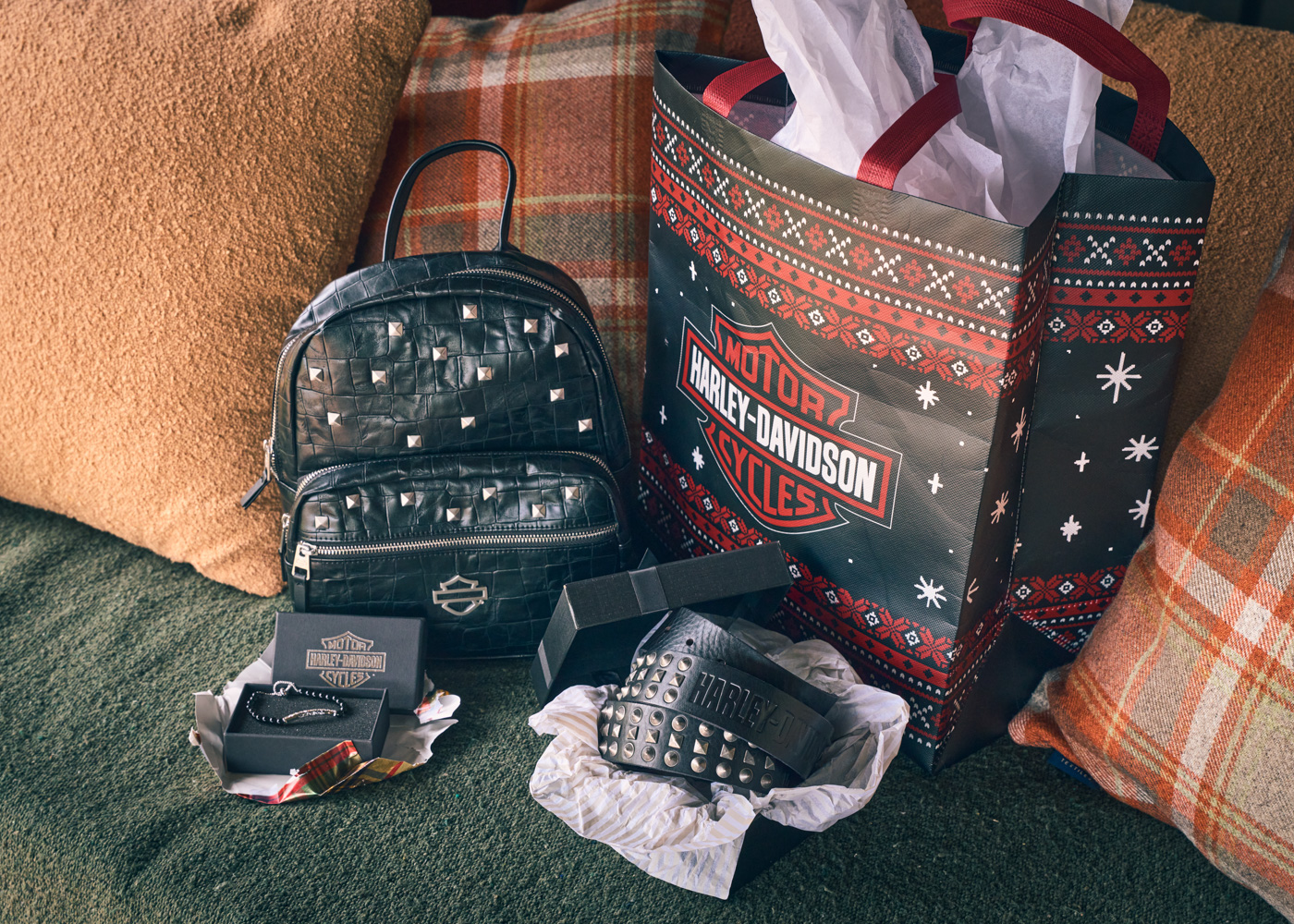 christmas packages and gifts on a couch