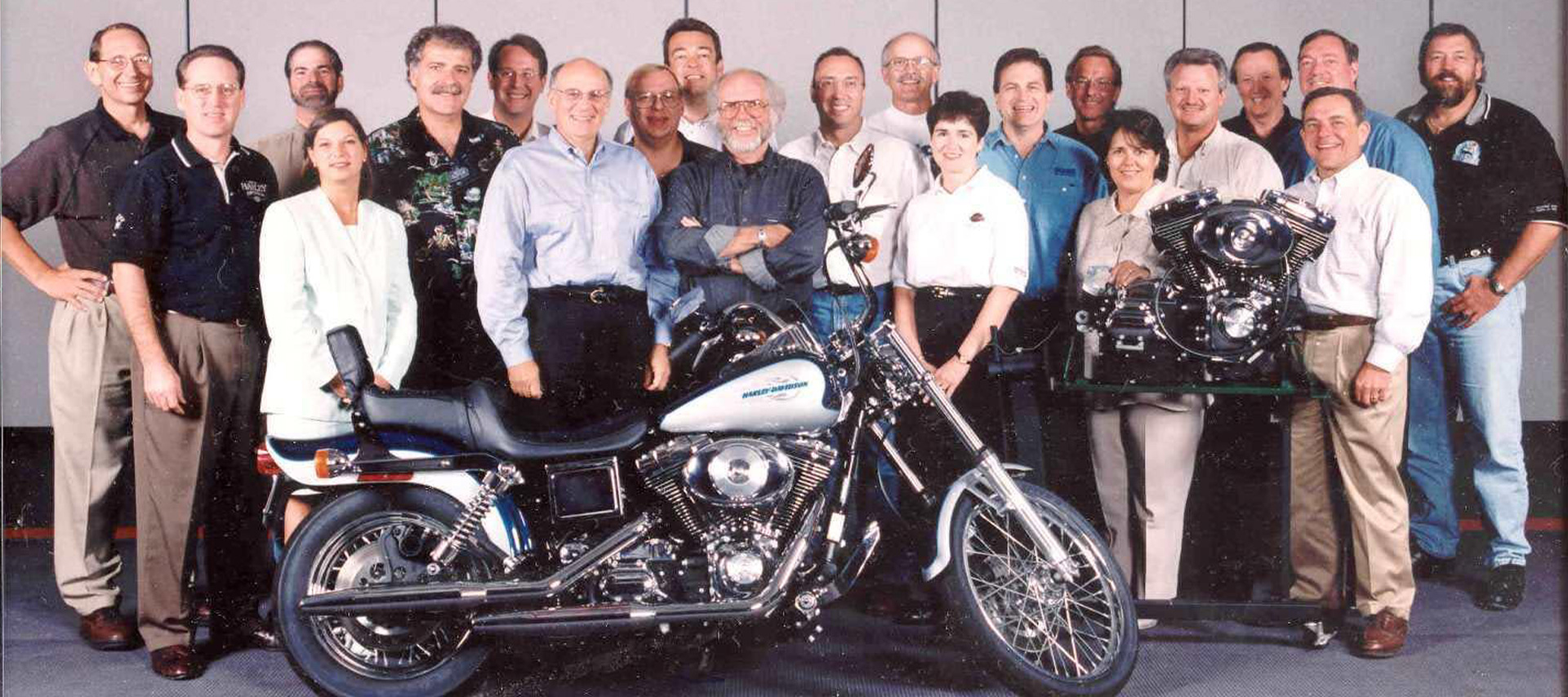 1988 executive staff posing behind twin can 88 engine