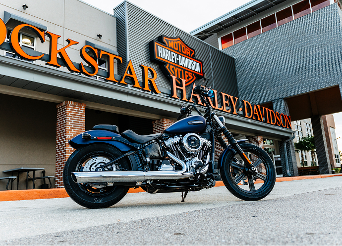 The Let’s Ride Challenge Gold Tier prize 2025 Street Bob parked in front of Rockstar Harley-Davidson