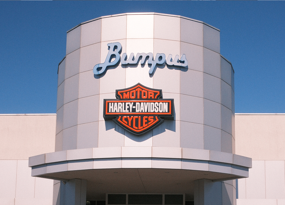 Exterior view of Bumpus Harley-Davidson building featuring modern architecture and prominent Harley-Davidson signage