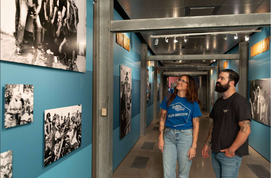 Guests exploring motorcycle history exhibit at Harley-Davidson Museum