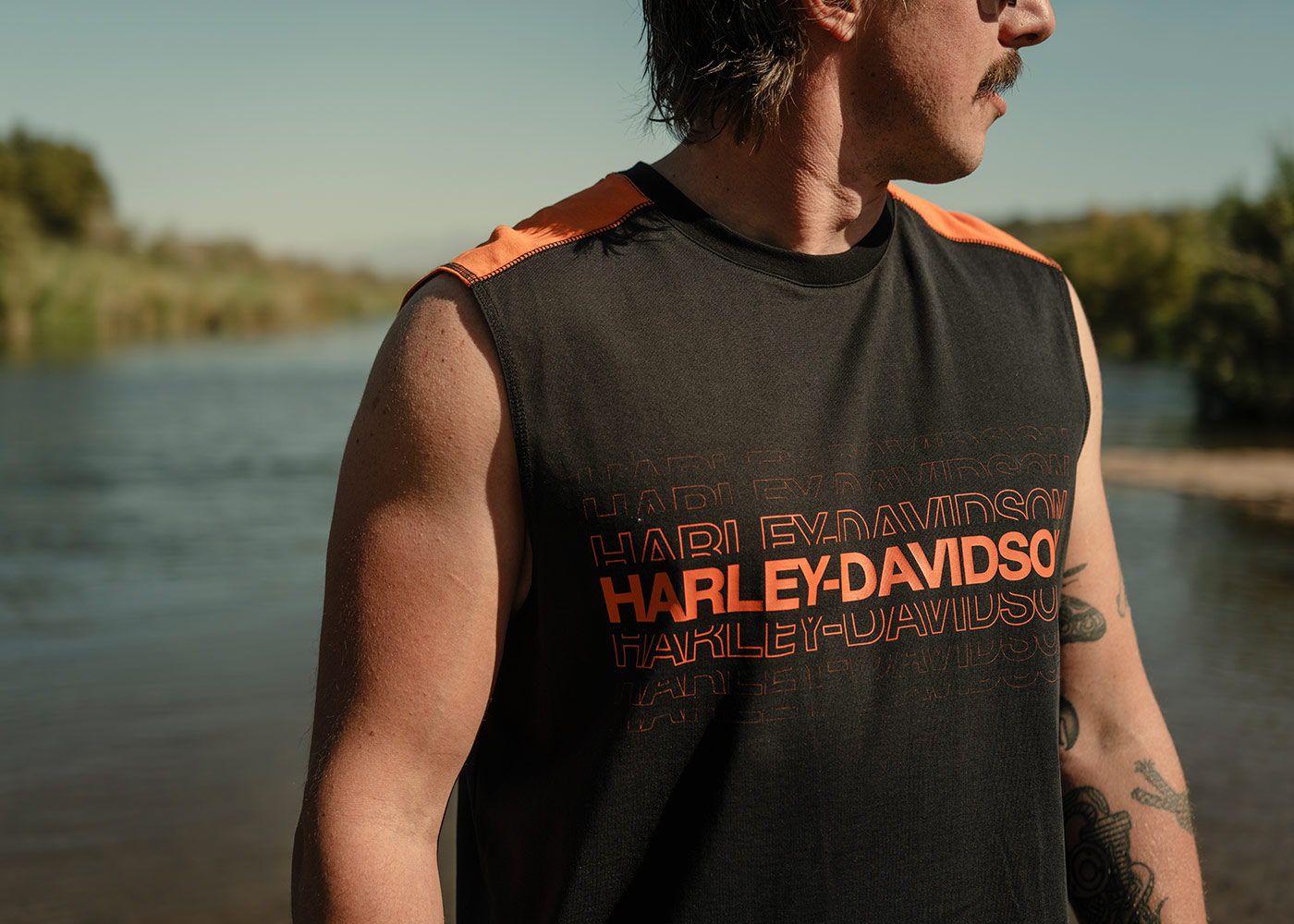 man in black sleeveless H-D t-shirt