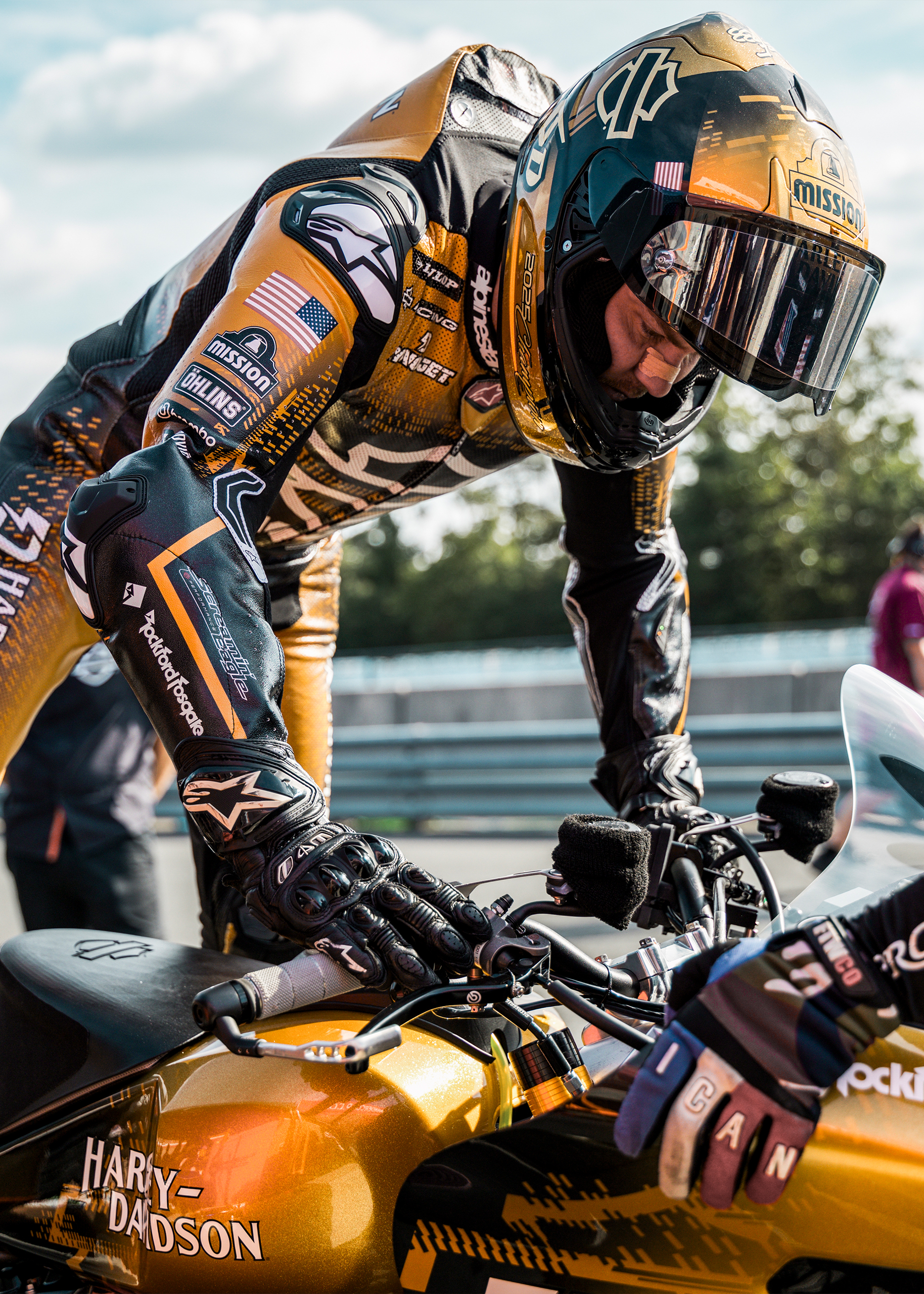 Kyle Wyman mounts his race bike in his winning gold livery during the final race of the King of the Baggers season.