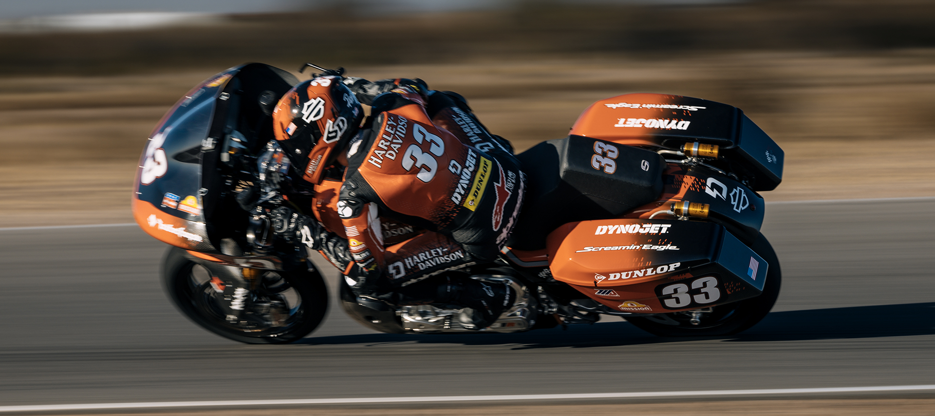 Kyle Wyman rides his race-prepared Road Glide deep into a corner on a racetrack