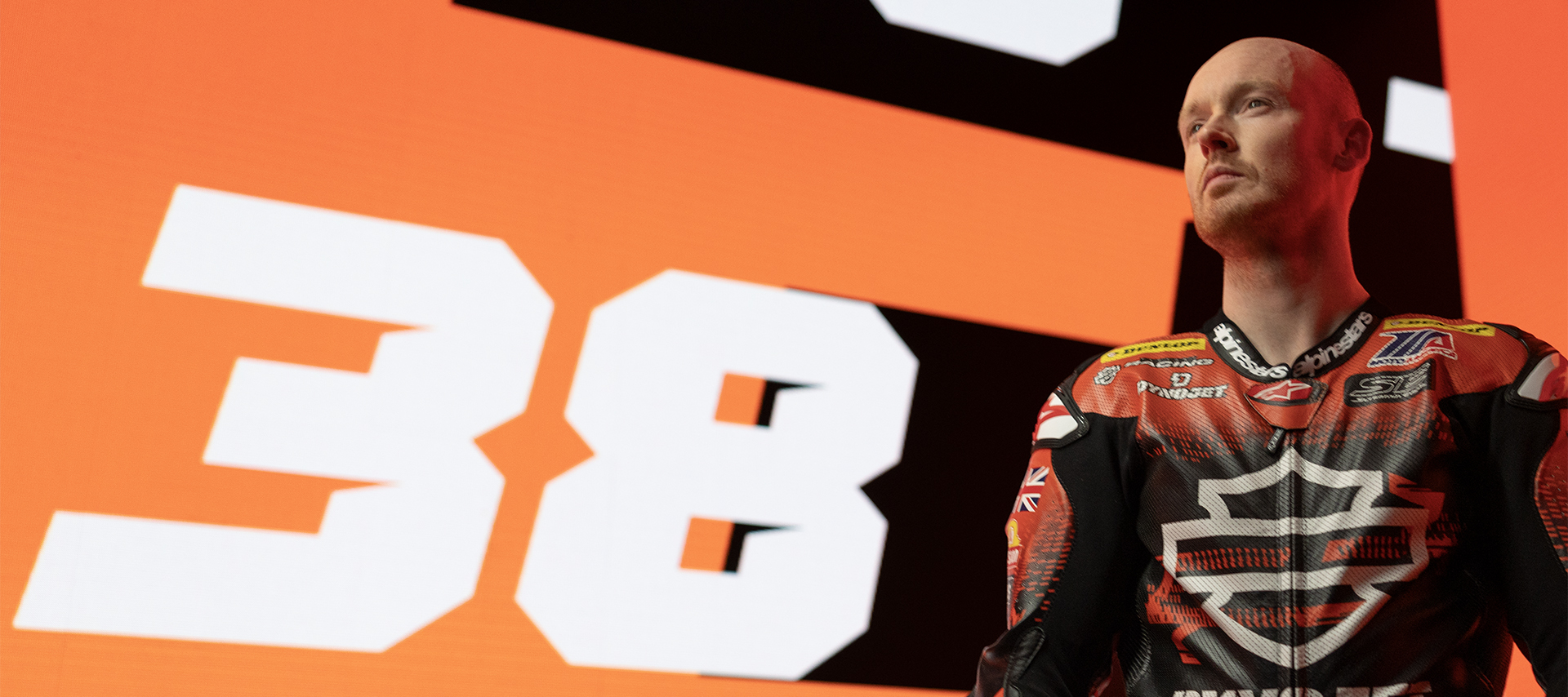 Bradley Smith stands before his number, 38 